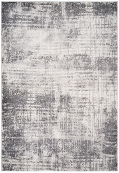 Gray and white abstract patterned rug on a white background