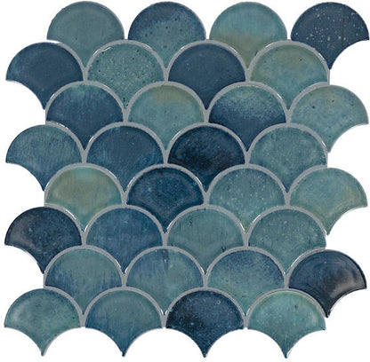 Pattern of blue and green fish-scale tiles on a white background