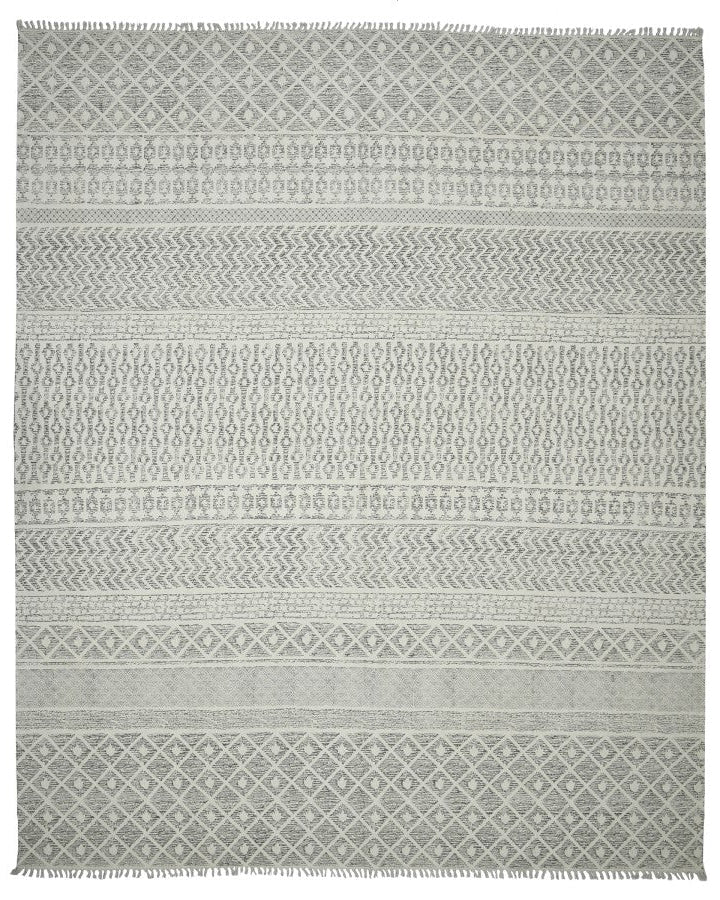 Patterned gray rug on a white background