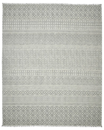 Patterned gray rug on a white background
