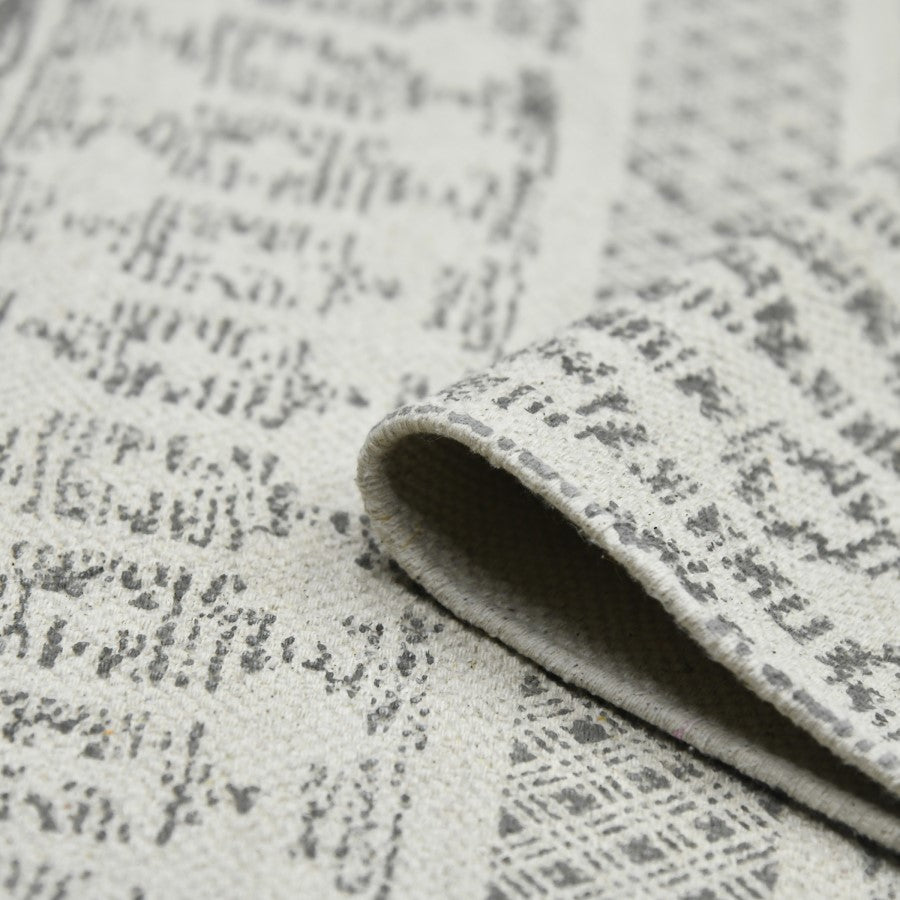 Close-up of textured gray fabric with a subtle pattern