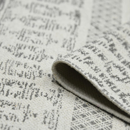 Close-up of textured gray fabric with a subtle pattern