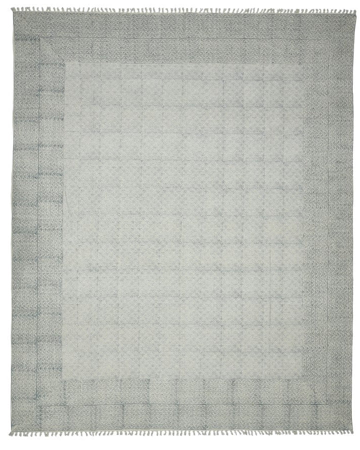 Gray area rug with a subtle pattern on a white background