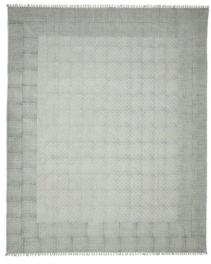 Gray area rug with a subtle pattern on a white background