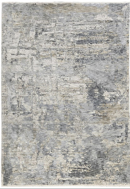 Textured area rug with a mix of gray and beige colors on a white background