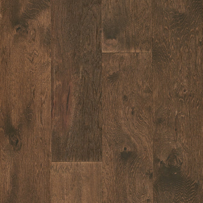Close-up of dark brown wooden flooring with visible grain and texture.