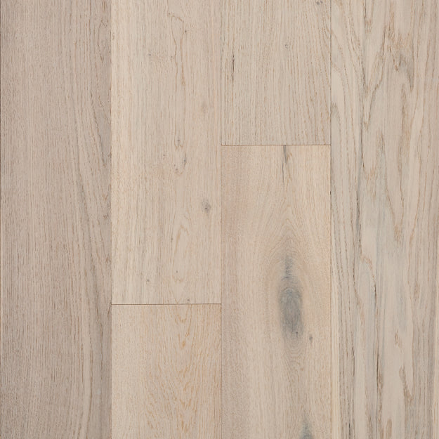 Close-up of a wooden floor with a light brown color and visible grain pattern.