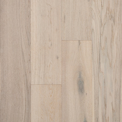 Close-up of a wooden floor with a light brown color and visible grain pattern.