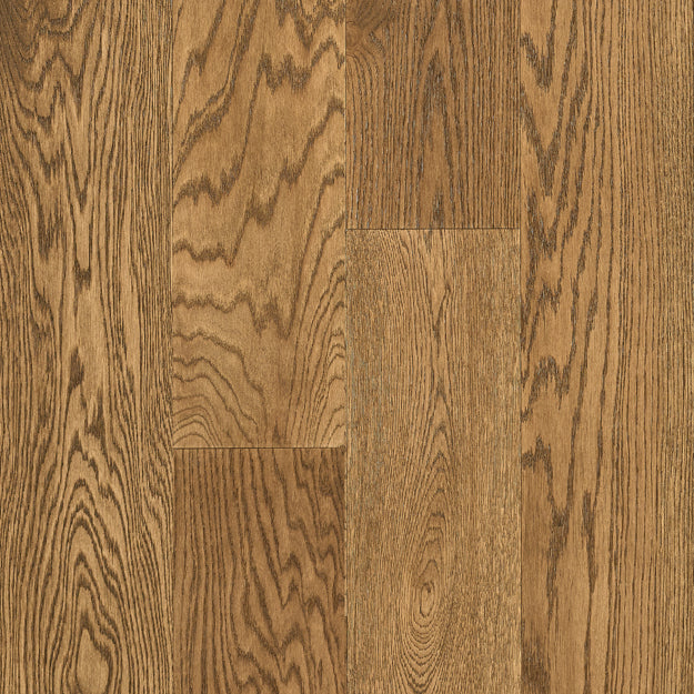 Close-up of wooden flooring with a natural brown color and visible grain pattern.