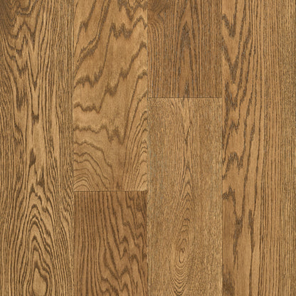 Close-up of wooden flooring with a natural brown color and visible grain pattern.