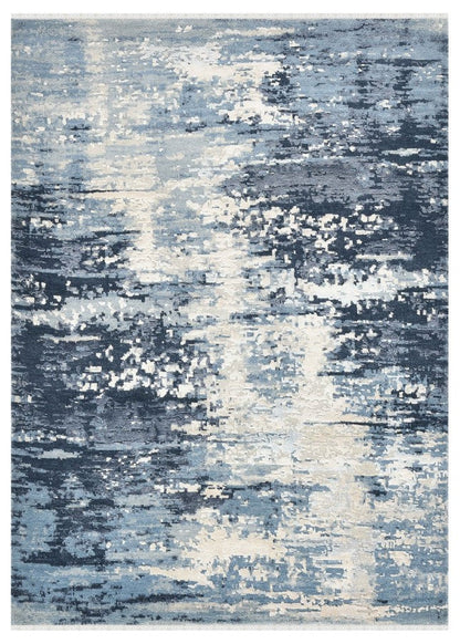 Abstract patterned rug with blue and white colors on a plain background