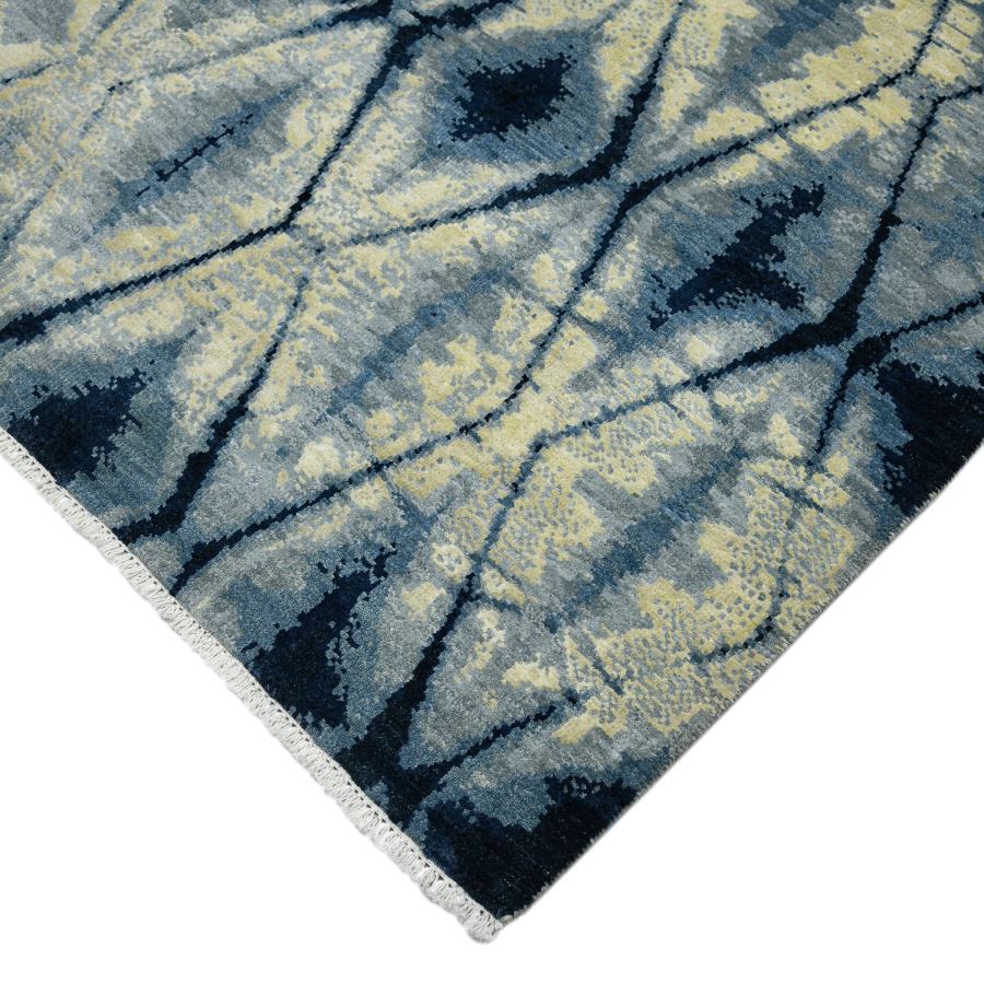 Close-up of a blue and beige patterned rug