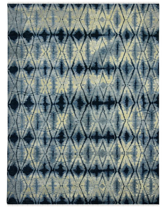 Rug with blue and beige geometric pattern on a white background