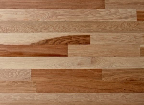 Wooden flooring with a variety of wood grain patterns and colors.