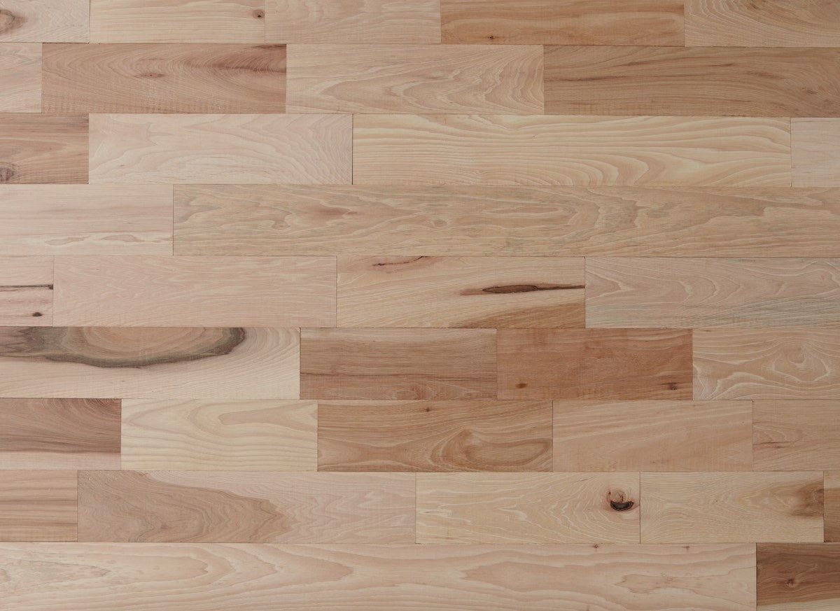 Close-up of a wooden floor with planks of varying widths.