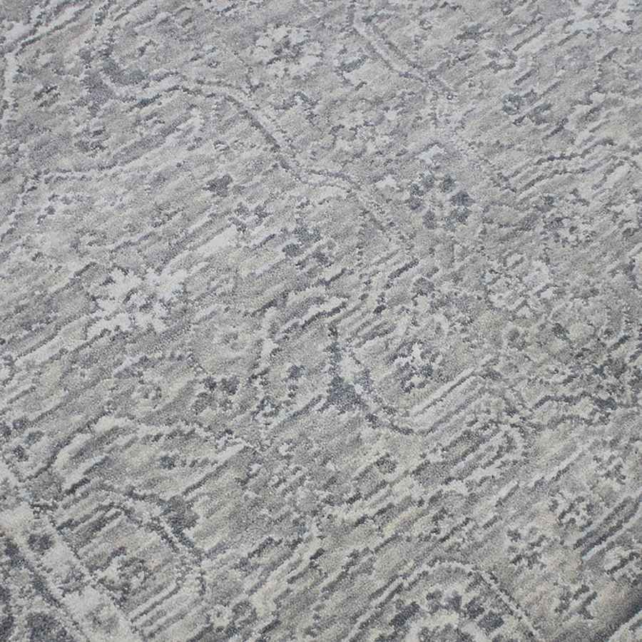 Close-up of a textured gray fabric with a subtle pattern