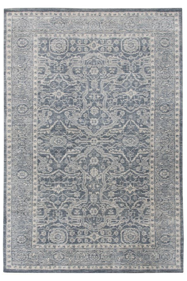 Decorative rug with intricate pattern on a white background