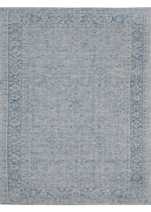 Blue patterned rug on a white background