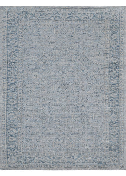 Blue patterned rug on a white background