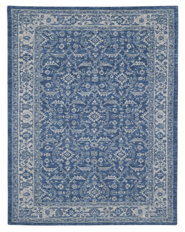 Blue patterned rug on a white background