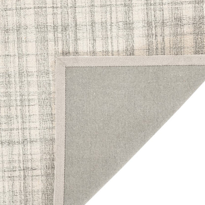 Textured rug corner with a neutral color palette on a white background