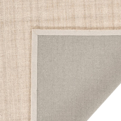 Close-up of a textured beige and gray rug corner