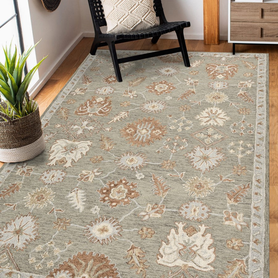 Floral patterned rug in a room with a chair and plant