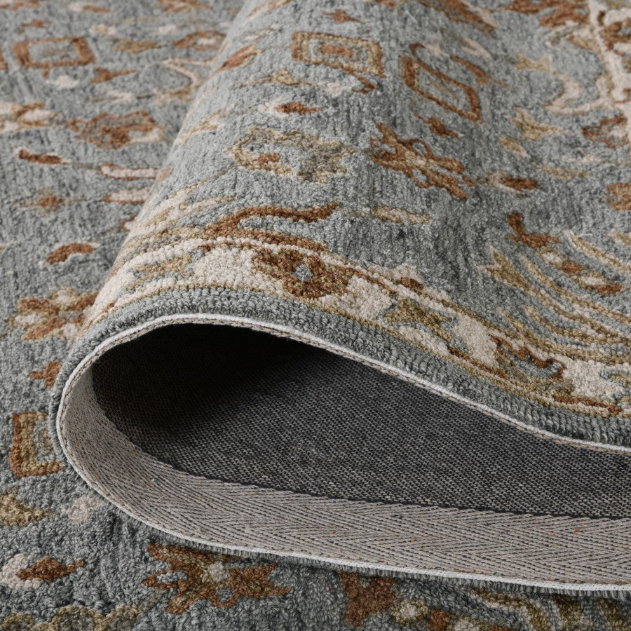 Close-up of a patterned rug with a focus on the texture and design.