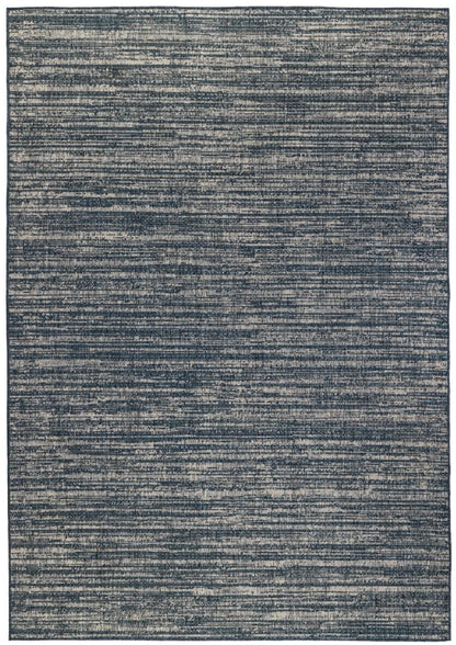 Rectangular blue rug with a textured pattern on a white background