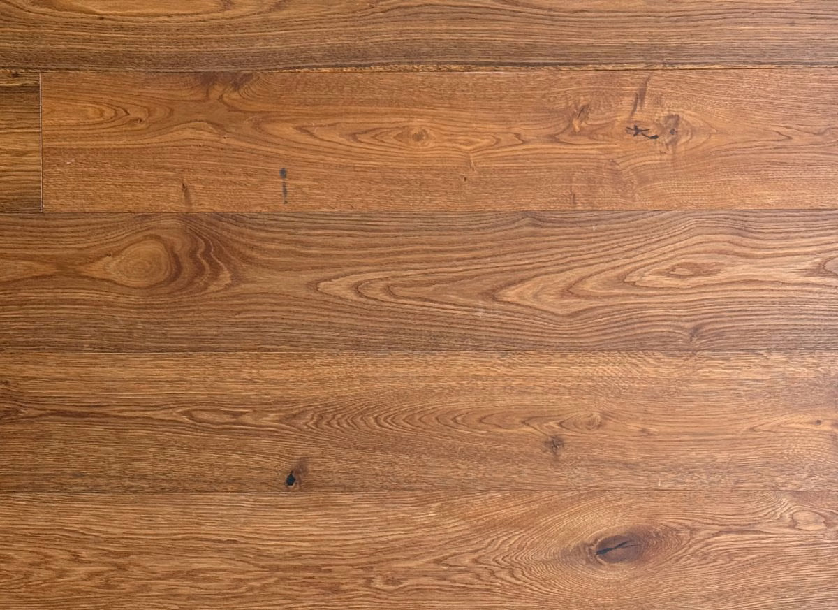 Close-up of a wooden floor with visible grain and texture