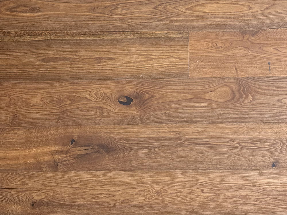 Close-up of a wooden floor with a brown and beige color scheme.