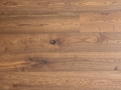 Close-up of a wooden floor with a brown and beige color scheme.
