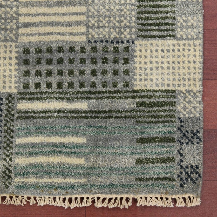 Patterned rug with geometric design on a wooden floor