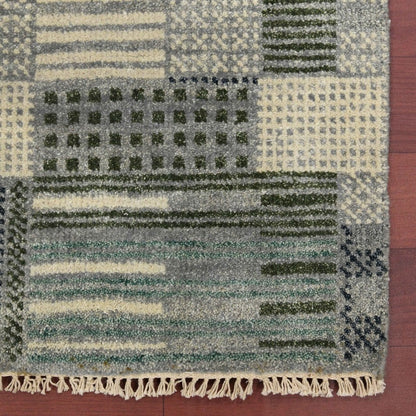 Patterned rug with geometric design on a wooden floor