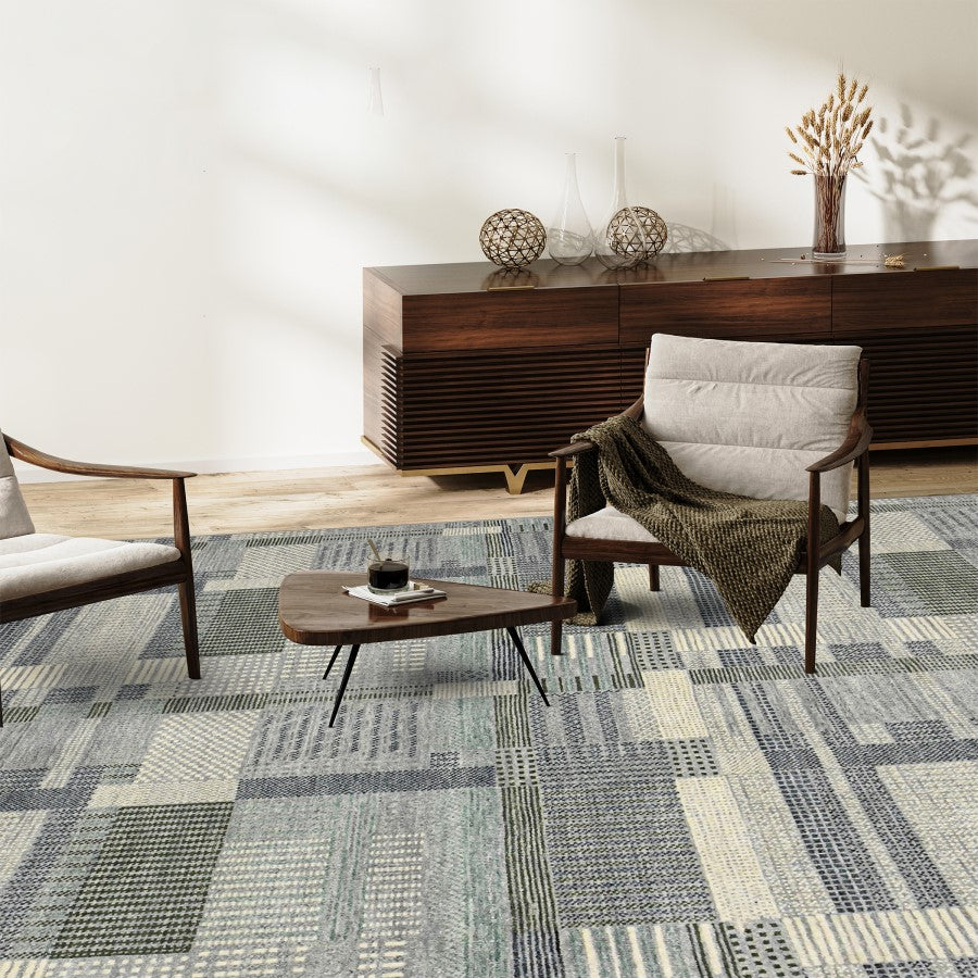 Modern office interior with patterned carpet, wooden furniture, and decorative elements.