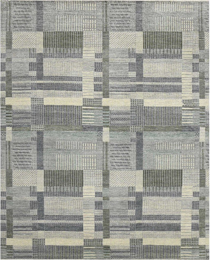 Patterned rug with geometric design on a white background
