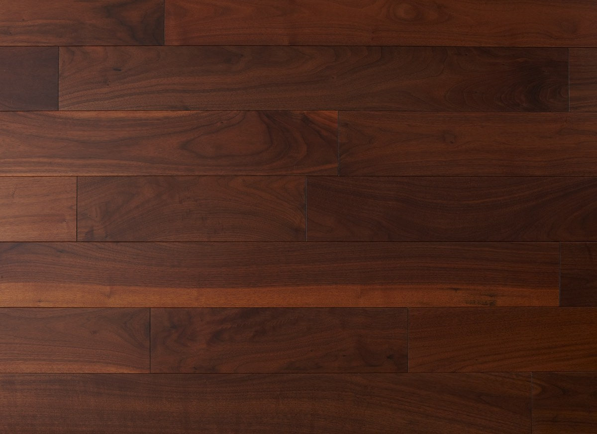 Close-up of a wooden floor with dark brown planks.