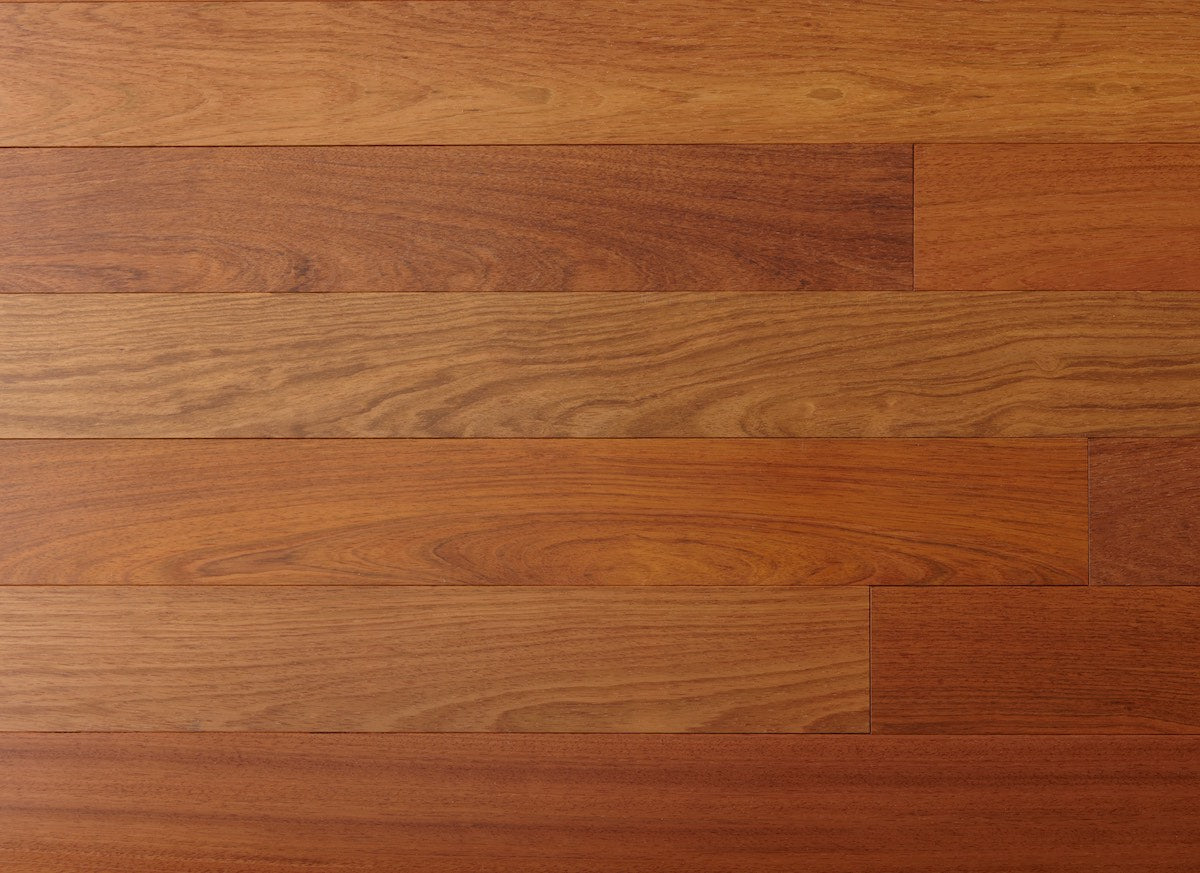Close-up of wooden flooring with a warm brown color.