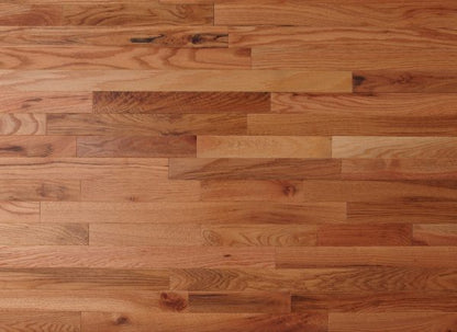 Wooden floor with planks of varying shades of brown.