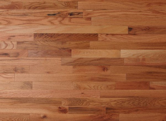 Wooden floor with planks of varying shades of brown.