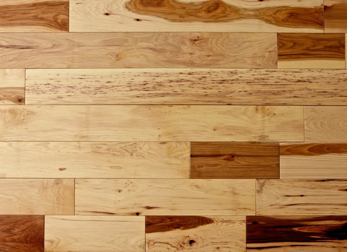Wooden floor with planks of different shades and patterns