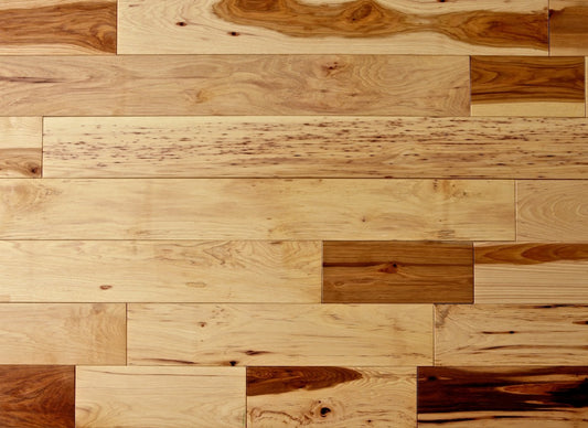 Wooden floor with planks of different shades and patterns