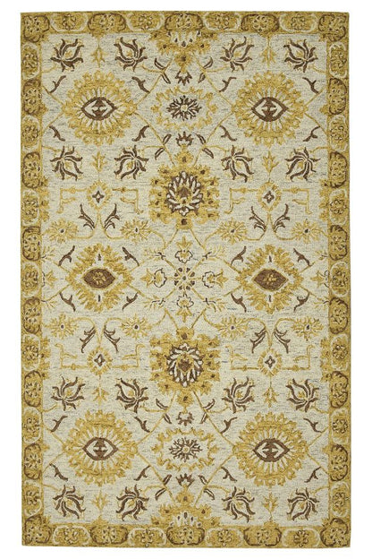 Decorative rug with intricate gold and brown pattern on a white background