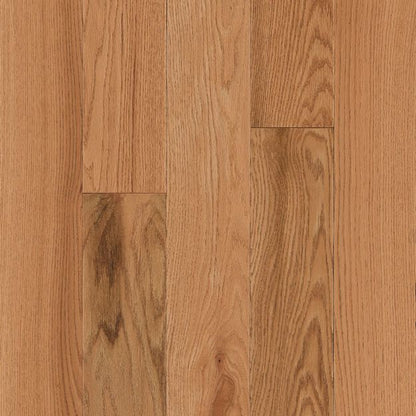 Close-up of wooden flooring with a warm brown color and visible grain pattern.