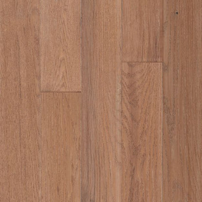 Close-up of a wooden floor with a warm brown color.