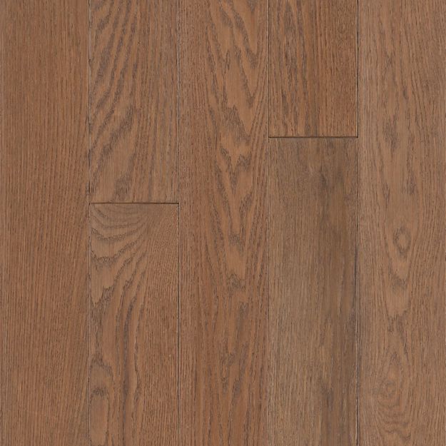 Close-up of a wooden floor with a rich brown color and visible grain pattern.