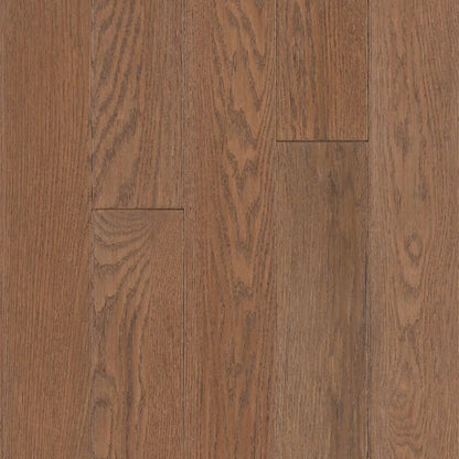 Close-up of a wooden floor with a rich brown color and visible grain pattern.