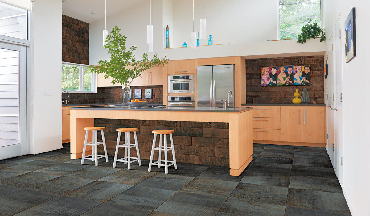 Modern kitchen with wooden island, stainless steel appliances, and decorative elements.