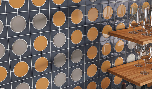 Tiled wall with circular pattern and wooden tables with glasses.