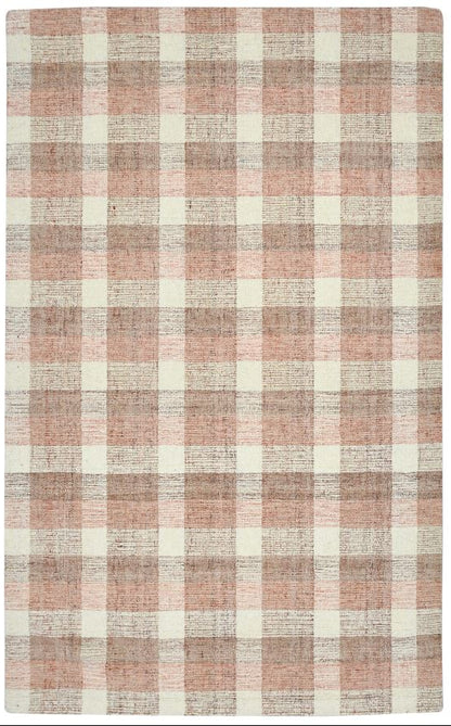 Plaid patterned rug with pink and beige colors on a white background